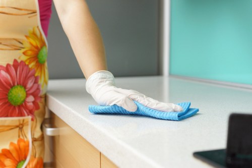 Cleaning professional preparing a service visit under agreed booking terms