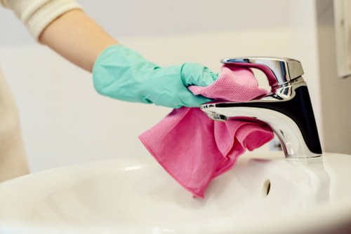 Cleaning team handling waste in line with safety and disposal requirements