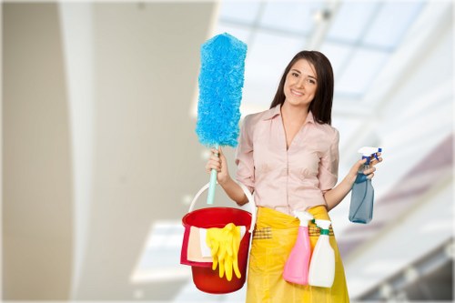Cleaning professional reviewing safety procedures with equipment