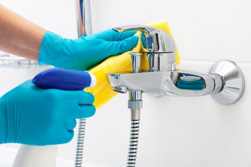 Professional cleaner using protective gear in a secure environment