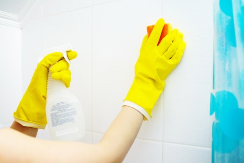 Cleaner removing baked-on grease from an oven in Fulham